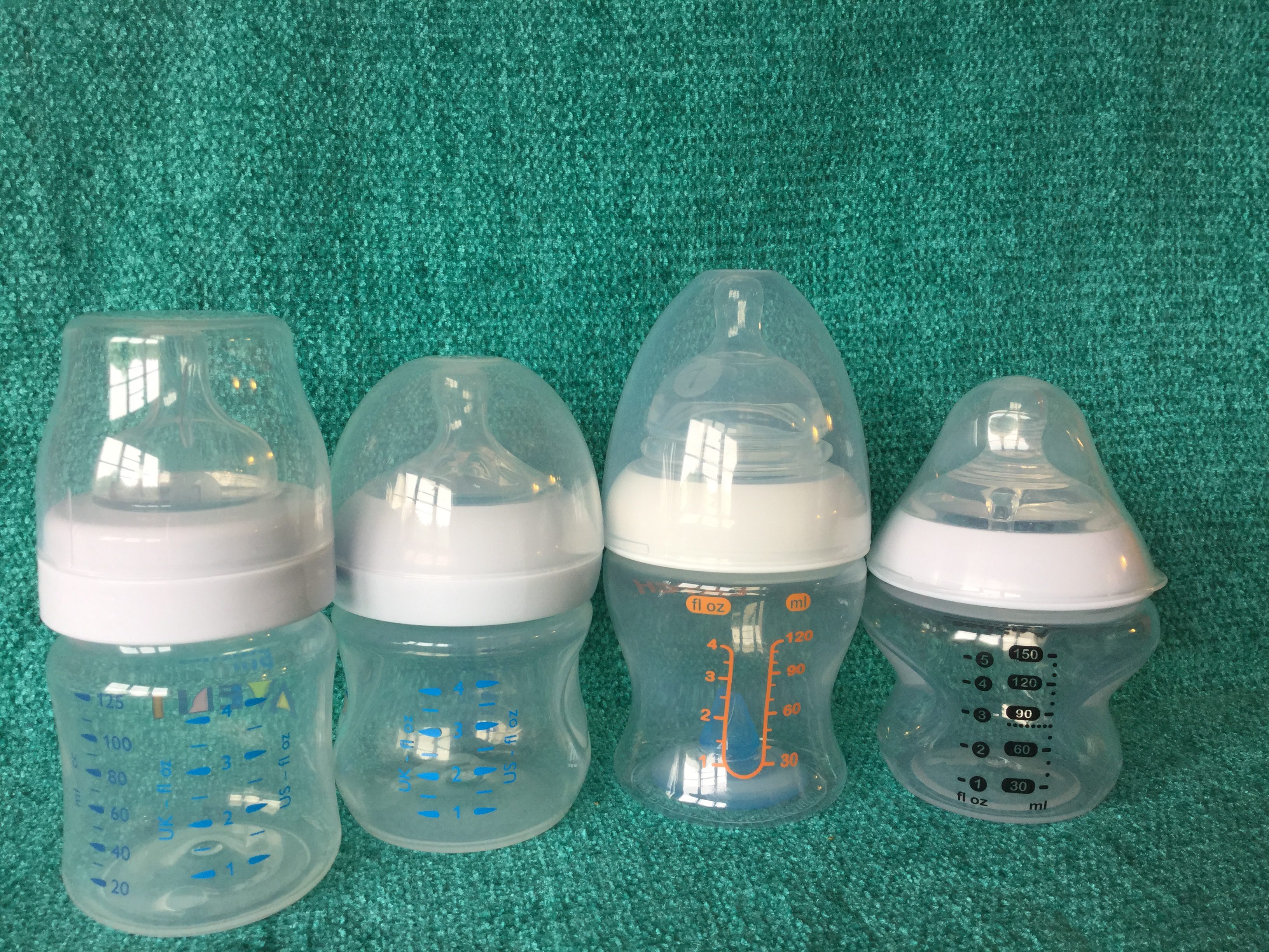 Examples of 4 baby bottles with good, clear, easy to read liquid guages