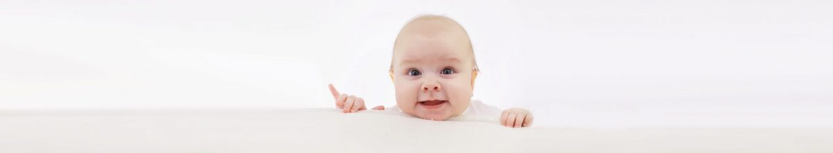 Baby and emotions. Little baby and place for text. Long poster.